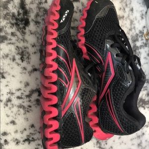 Black and red rebook athletic shoes